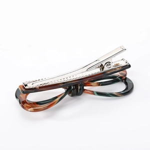 French style acetate bow hair clip with retro tortoiseshell texture and metal grip