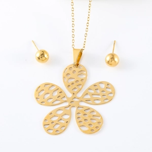 Golden hollow floral necklace and bead earring jewelry set for women on white background