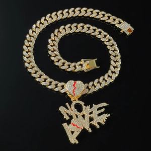 Gold plated iced out Cuban chain necklace with VOTE letter and red cracked heart pendant