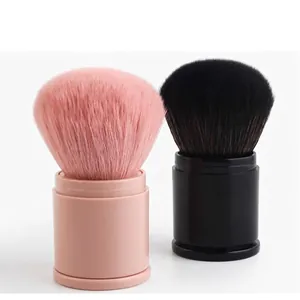 Portable retractable makeup brush set with large round powder brush in pink and black