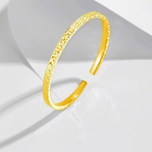 Modern gold adjustable open bangle with sparkling hammered honeycomb texture for women
