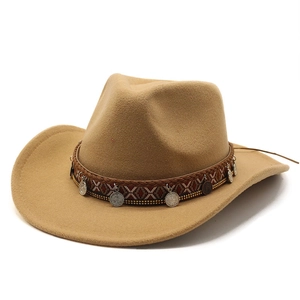Detail of khaki wool felt cowboy hat with ethnic braided band and vintage metal coins