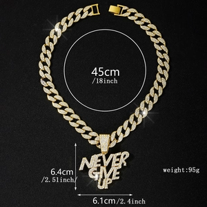 Detail view of NEVER GIVE UP hip hop pendant with cubic zirconia on a gold Cuban chain