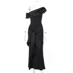 Detail of elegant black off-shoulder dress featuring satin pleats and matte fabric texture