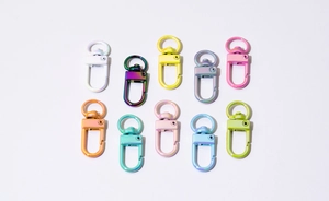 Colorful spring snap hooks in various gradient shades for DIY keychains and bag accessories