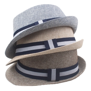 Detailed weave of men's summer straw trilby hats in blue, beige, and coffee colors