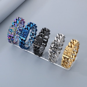 Five assorted skull tag bracelets in rainbow, blue, black, silver, and gold steel finishes