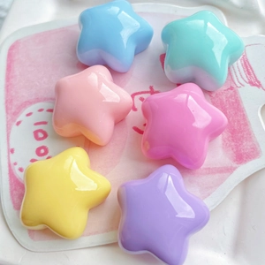 Macro shot of 6 assorted macaron colored puffy star resin charms for DIY craft projects