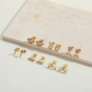 Exquisite gold-plated earring set featuring colorful zircon in arrow and evil eye designs