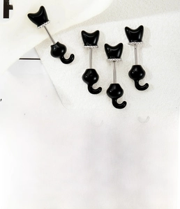 Detail showing titanium steel black cat ear cartilage stud with cubic zirconia collar