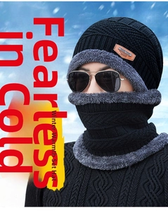 Detail of black winter knit hat and neck warmer set with thick grey plush lining