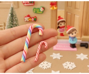 Close-up of miniature red-white and rainbow candy canes for dollhouse Christmas decor