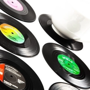 Set of six retro vinyl record coasters with colorful labels for creative home coffee tables