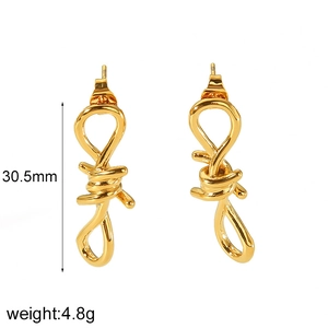 Detail shot of golden butterfly earrings with 30.5mm height and 4.8g weight specs