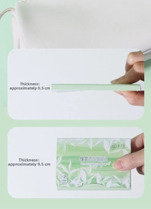 Macro detail of green tea oil absorbing sheets showing slim packaging and thin paper texture