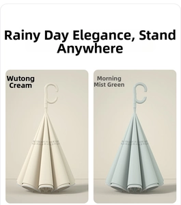 Detail of reverse folding umbrella with C-shaped handle in beige and green colors