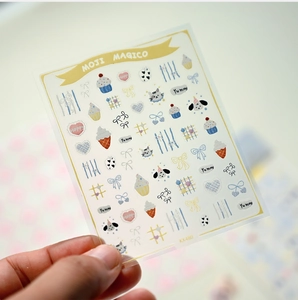 Close-up of cute cartoon puppy and bowknot nail art stickers with matte adhesive finish