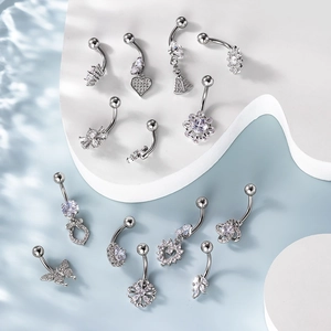 Set of 12 silver stainless steel belly rings with sparkling zircon inlay patterns