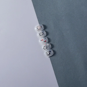 Detailed view of 5D embossed Japanese sumo nail stickers with red sun and cloud patterns