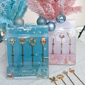 Christmas dessert spoon set with golden handles and colorful holiday enamel charms