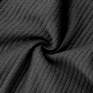 Macro shot of dark grey ribbed knit fabric showing soft texture and vertical stripe detail