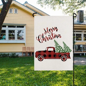 Outdoor view of Merry Christmas garden flag with red plaid truck on linen fabric