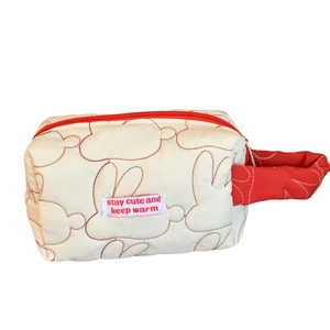Quilted white cotton rabbit makeup bag with red zipper and stay cute slogan handle