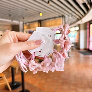 Pink bow hair ties set with floral and lace patterns for girls on display card