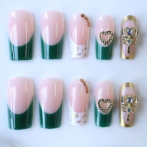 French tip press-on nails in green and pink with golden heart and rhinestone charms