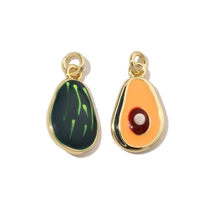 Macro shot of green avocado charms with gold metal edges and oil-drop glaze finish