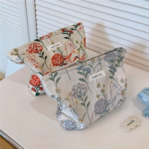 Detailed embroidery texture on jacquard canvas makeup bags with floral patterns