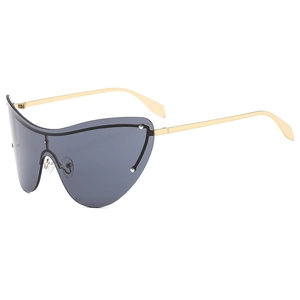 Modern rimless cat eye sunglasses with gray lenses and slim gold metal frame on white backdrop