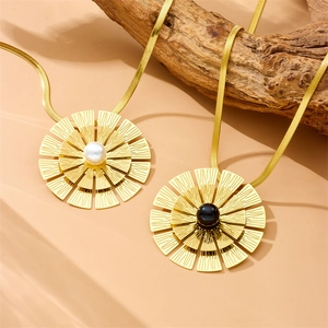 Golden snake chain necklaces featuring sunflower pendants with pearl and black gemstone