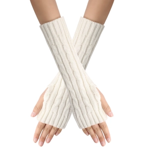 Macro detail of white cable knit fingerless arm warmers with twisted rope pattern textures
