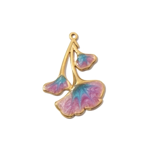 Detailed view of ginkgo leaf pendant with golden edges and gradient enamel glaze inlay
