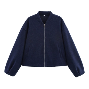 Detailed flat lay of a navy blue zip-up jacket with stand collar and lantern sleeves