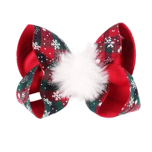 Christmas hair clip with 4-inch red and green plaid bow, snowflake pattern and white pom-pom