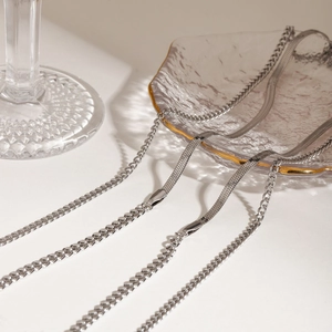 Double-layered silver stainless steel necklace featuring Cuban and flat snake chains