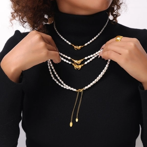 Elegant multi-layer pearl necklace with golden handshake clasp pendants for women