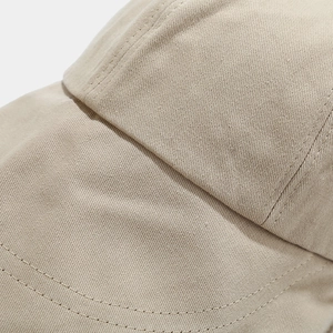 Detailed close-up of khaki sun hat showing premium twill fabric and neat double stitching