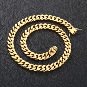 Detail of 13mm gold cuban link chain featuring flat interlocking links and rectangle clasp