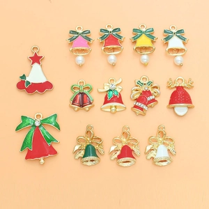 Detail of Christmas alloy enamel charms featuring festive bells and trees with pearls