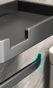 Detail of the anti-slip curved tip on the dark grey bathroom toilet paper holder