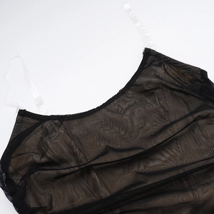 Detailed view of black mesh fabric texture and transparent adjustable shoulder straps