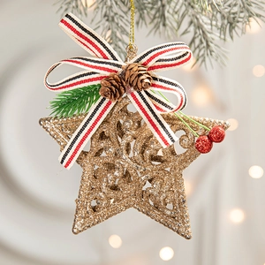 Golden star Christmas ornament with pine cones, red berries and a festive striped bow