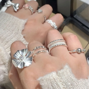 Stackable silver flower and pearl rings for women with minimalist bow and woven designs
