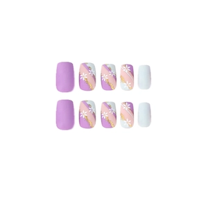 Blue and purple French press-on nails with white flower patterns and gold foil accents