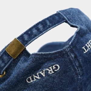 Denim baseball cap in dark blue with GRAND embroidery and vintage metal buckle