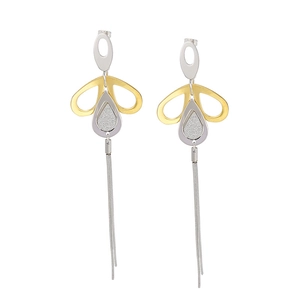 Modern two-tone geometric drop earrings with long metallic fringe tassels on white background