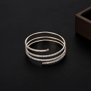 Close-up of multi-layer spiral rose gold bridal bracelet with sparkling crystal rhinestones